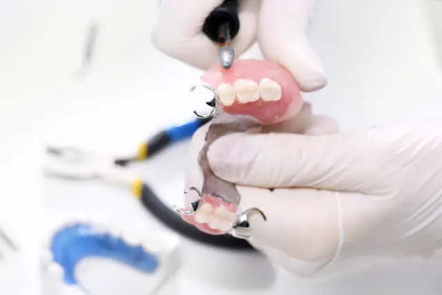 dentures being fixed